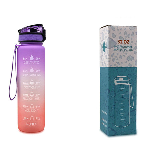 Gradient water bottle with pink to purple color scheme and packaging on a white background