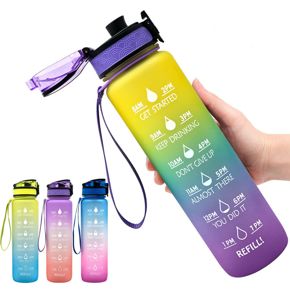 Gradient water bottle with time markers and a hand holding it