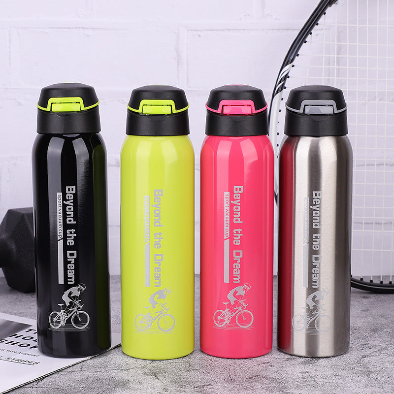 Four colorful water bottles with 'Beyond the Dream' branding on a textured surface.