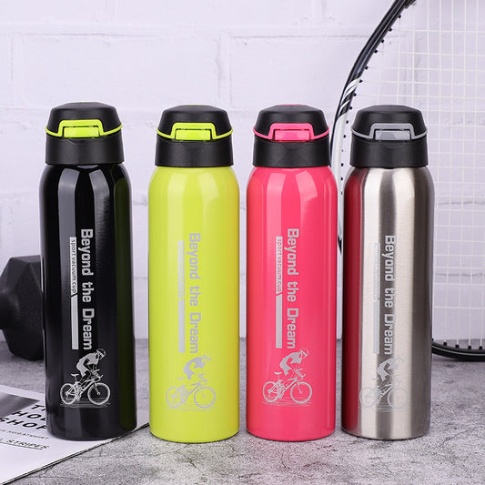 Four colorful water bottles with 'Beyond the Dream' branding on a textured surface.