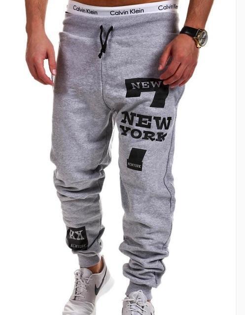 Gray sweatpants with 'New York' text and brand logo on a white background