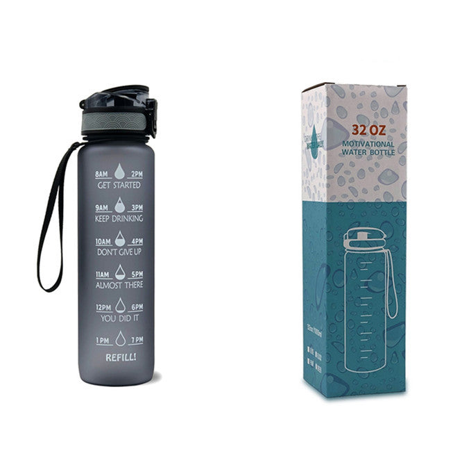 Motivational water bottle with time markers and packaging on a white background