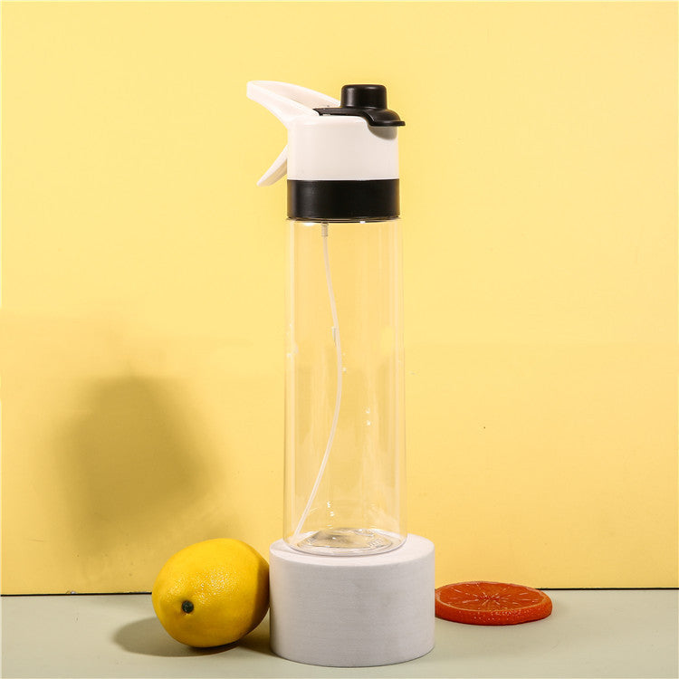 Clear glass water bottle with white cap and base on a yellow background