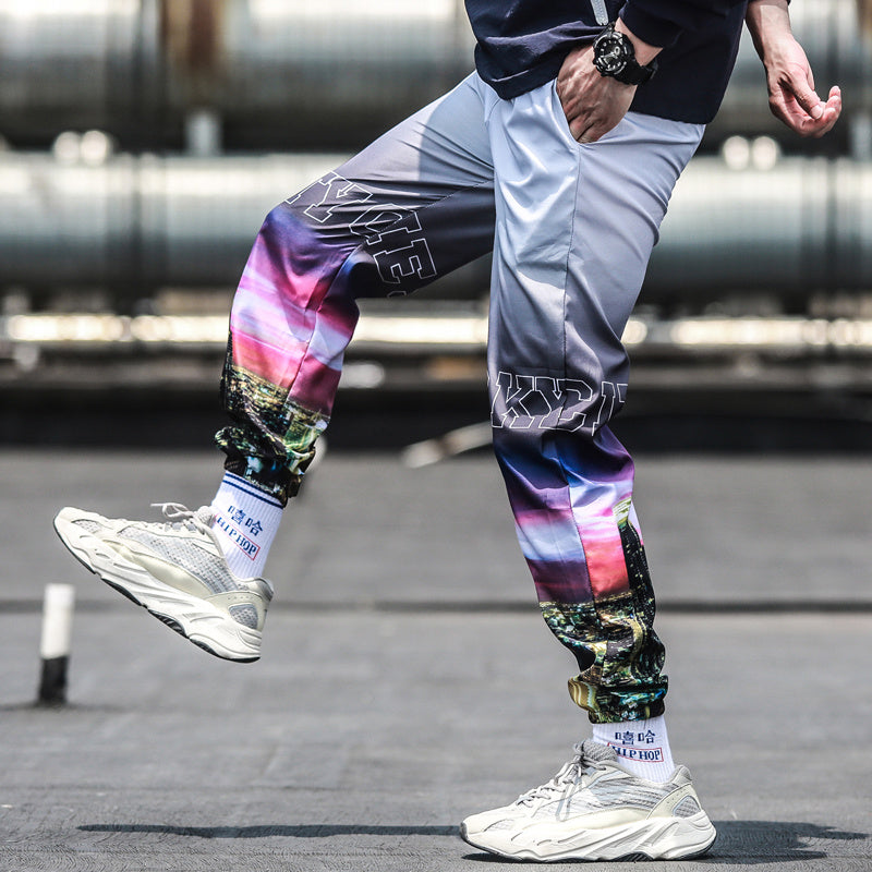 Person wearing colorful pants with a blurred background