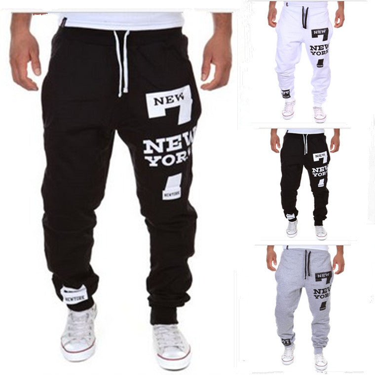 Black jogger pants with 'New York' text on a white background