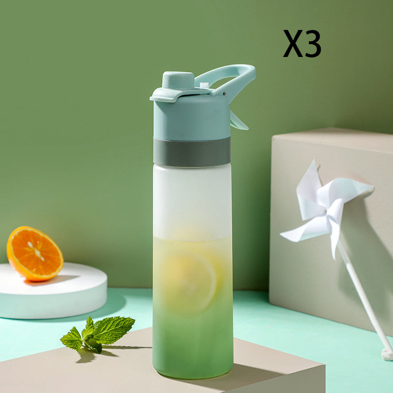 Gradient water bottle with lemon and mint on a green background