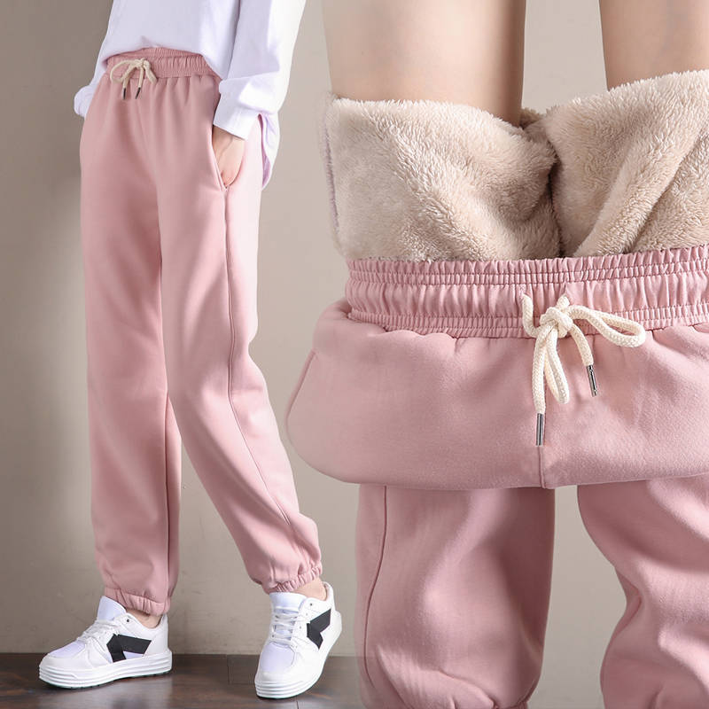 Pink fleece-lined pants worn by a person with a neutral background