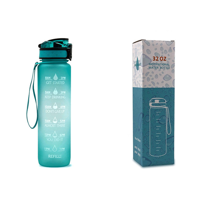 Teal water bottle with motivational text and carrying strap, next to its packaging box on a white background.