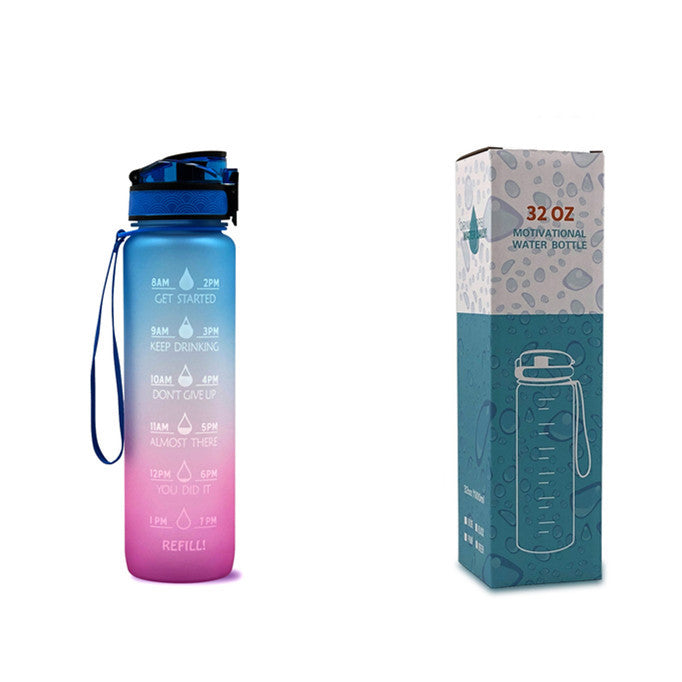 Gradient blue to pink water bottle with measuring markings and a matching box on a white background