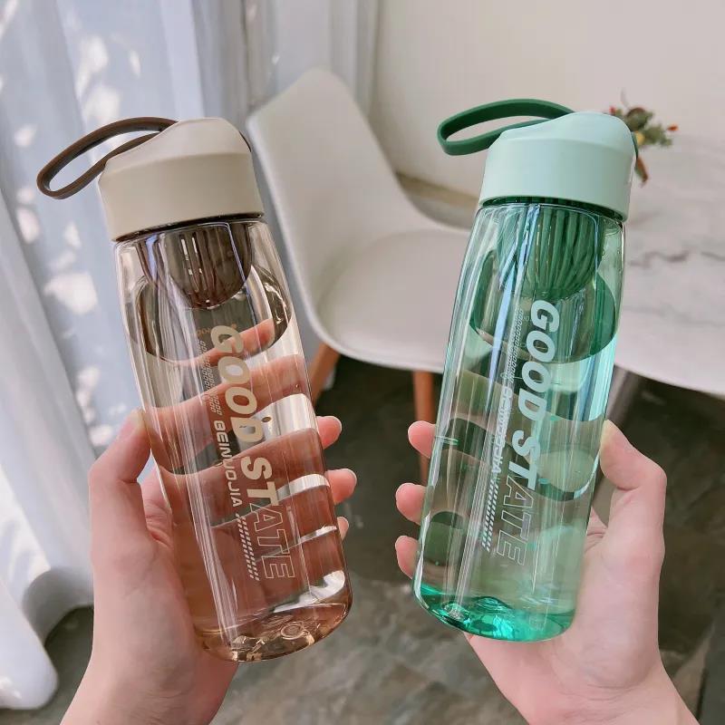 Two hands holding clear water bottles with 'Good State' branding.