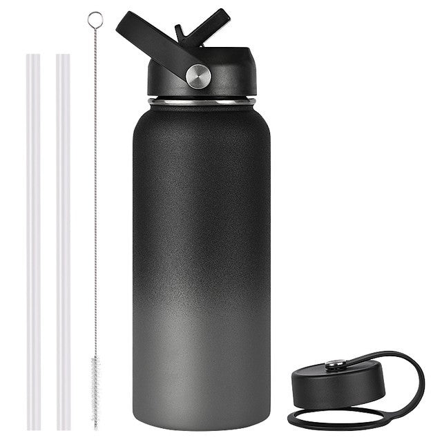 Black water bottle with straw and additional cap on a white background